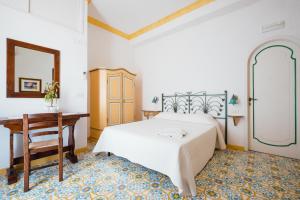 Postel nebo postele na pokoji v ubytování B&B Orto Paradiso