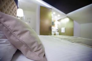 Voodi või voodid majutusasutuse 4Rooms 4U toas