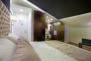 Voodi või voodid majutusasutuse 4Rooms 4U toas