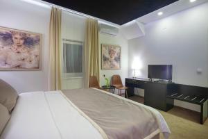 Voodi või voodid majutusasutuse 4Rooms 4U toas