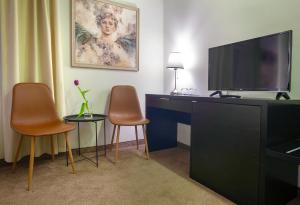 Televiisor ja/või meelelahutuskeskus majutusasutuses 4Rooms 4U