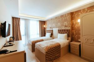 A bed or beds in a room at Istanroom by Keo