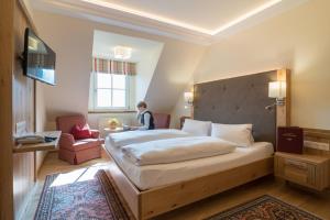 Łóżko lub łóżka w pokoju w obiekcie Hotel-Restaurant Kirchenwirt