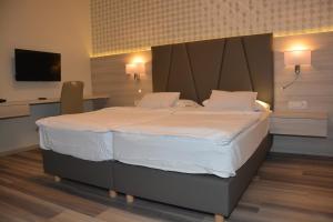 Postel nebo postele na pokoji v ubytování Hotel Fiesa