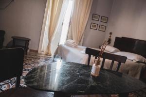 Postelja oz. postelje v sobi nastanitve Borgo Civico 10