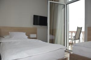 Postel nebo postele na pokoji v ubytování Hotel Fiesa