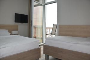 Postel nebo postele na pokoji v ubytování Hotel Fiesa