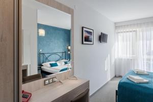 Postel nebo postele na pokoji v ubytování Hotel Porec