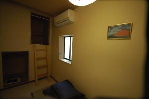 Posteľ alebo postele v izbe v ubytovaní Chambre dhote Tatami