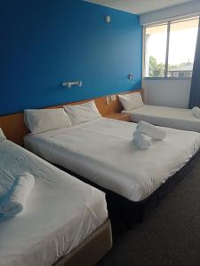 Postel nebo postele na pokoji v ubytování Annerley Motor Inn
