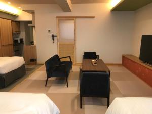 Postel nebo postele na pokoji v ubytování Hotel Yururito Osaka