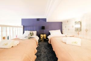 Posteľ alebo postele v izbe v ubytovaní Art Apartment