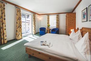 Voodi või voodid majutusasutuse Hotel Post Sils Maria toas