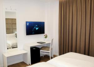 Voodi või voodid majutusasutuse Ramel Hotel toas