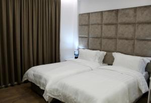 Voodi või voodid majutusasutuse Ramel Hotel toas