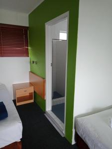 Postel nebo postele na pokoji v ubytování Annerley Motor Inn
