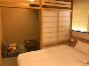 Postel nebo postele na pokoji v ubytování Hotel Yururito Osaka