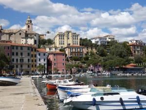 a group of boats docked in a harbor with buildings at LA VALLETTA SUL MARE in La Spezia