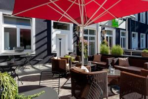 Un restaurante u otro lugar para comer en ibis Styles Dortmund West