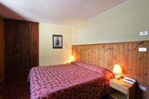 Postel nebo postele na pokoji v ubytování Hotel Dolonne