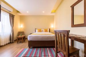 Letto o letti in una camera di Hotel Mala Pokhara