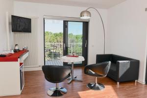 A television and/or entertainment centre at Stay Michelangelo Jesolo Only Adults