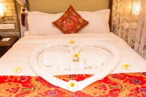 Letto o letti in una camera di Hotel Mala Pokhara