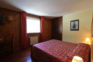Postel nebo postele na pokoji v ubytování Hotel Dolonne