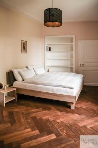 Ένα ή περισσότερα κρεβάτια σε δωμάτιο στο Manoir de la Côte-Dieu