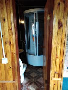 a small bathroom with a toilet and a sink at Hostel Hola in Chernihiv