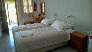 A bed or beds in a room at Kamelia