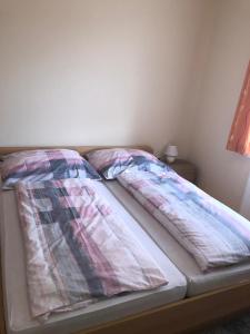 Ein Bett oder Betten in einem Zimmer der Unterkunft Gasthof-Pension Reidnwirt