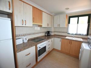 Kuchyň nebo kuchyňský kout v ubytování Apartamento Jardines del Mar