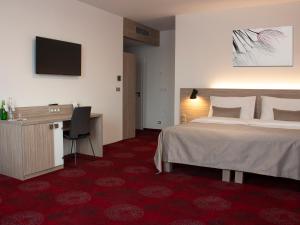 Postel nebo postele na pokoji v ubytování Hotel TAMMEL