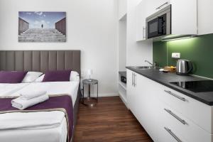 Kuchyň nebo kuchyňský kout v ubytování Elizabeth Suites
