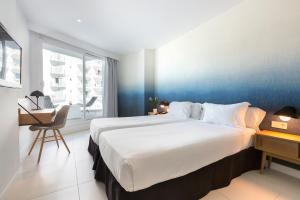 Ein Bett oder Betten in einem Zimmer der Unterkunft HM Tropical