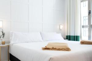 Postel nebo postele na pokoji v ubytování Cosmo Hotel Boutique