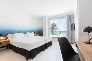 Ein Bett oder Betten in einem Zimmer der Unterkunft HM Tropical