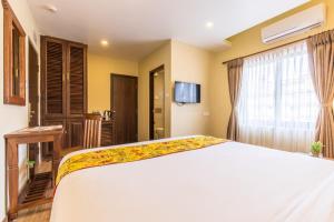 Letto o letti in una camera di Hotel Mala Pokhara