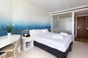 Ein Bett oder Betten in einem Zimmer der Unterkunft HM Tropical