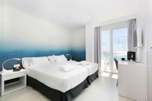 Ein Bett oder Betten in einem Zimmer der Unterkunft HM Tropical
