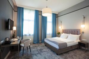 Posteľ alebo postele v izbe v ubytovaní Hotel Unicus Krakow Old Town - Destigo Hotels