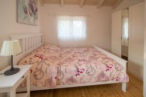 Postel nebo postele na pokoji v ubytování Villa Petite