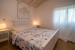 Postel nebo postele na pokoji v ubytování Villa Petite