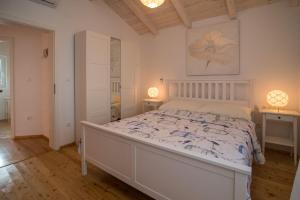 Postel nebo postele na pokoji v ubytování Villa Petite + 16 fotografií