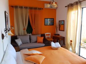 A bed or beds in a room at Violetta Rooms