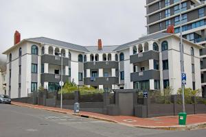 a large apartment building on the side of a street at Warwick Mansions 7 in Cape Town