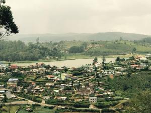 a small town with a river and a city at Single Tree Hotel in Nuwara Eliya