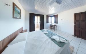Cama o camas de una habitación en Pousada Cores dos Corais