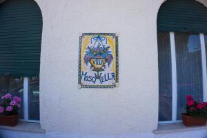 a sign for a music club on the side of a building at Villa Moschella in Taormina